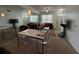 Bright and airy living area with a dining table, TV, and large windows, perfect for modern living at 4002 San Gallo Dr # 105, Kissimmee, FL 34741