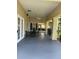 Covered patio with comfortable seating area and tranquil views at 4002 San Gallo Dr # 105, Kissimmee, FL 34741