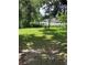 Lush back yard offering serene outdoor space at 4035 Nimons St, Orlando, FL 32811