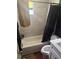 Updated bathroom with shower-tub combination at 4035 Nimons St, Orlando, FL 32811