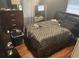 Bedroom featuring a bed with graphic patterned bedding, and dark wood dresser at 4035 Nimons St, Orlando, FL 32811