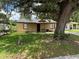 Charming single-story home featuring a quaint front porch and well-maintained lawn at 4035 Nimons St, Orlando, FL 32811