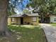 Charming single-story home featuring a quaint front porch and well-maintained lawn at 4035 Nimons St, Orlando, FL 32811