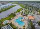 A community aerial showcasing pools, splash pad, mini golf, dock, and surrounding waterways at 4367 Rhyme St, Kissimmee, FL 34746