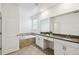 Bathroom featuring a soaking tub, quartz countertops, double sinks, white cabinets, and tile flooring at 4367 Rhyme St, Kissimmee, FL 34746