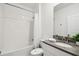 Clean white bathroom features a shower-tub combo and modern vanity at 4367 Rhyme St, Kissimmee, FL 34746