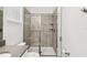 Bathroom showcasing a glass-enclosed shower with tile surround and modern fixtures at 4367 Rhyme St, Kissimmee, FL 34746
