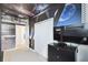 Bedroom featuring a space-themed wall mural, closet, carpet, and modern TV set upon a black dresser at 4367 Rhyme St, Kissimmee, FL 34746