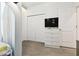 room showing closet and TV with bow themed wallpaper, perfect for sleep and play at 4367 Rhyme St, Kissimmee, FL 34746