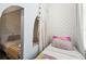 A charming room with built in bed and bow themed wallpaper creates a cozy, whimsical retreat at 4367 Rhyme St, Kissimmee, FL 34746