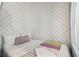 A cozy built-in bed offers a serene retreat with bow themed wallpaper at 4367 Rhyme St, Kissimmee, FL 34746