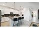 Bright, modern kitchen with white cabinets, gray countertops, and stainless steel appliances at 4367 Rhyme St, Kissimmee, FL 34746