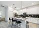 Stylish kitchen features a center island, stainless steel appliances, and sleek, modern finishes at 4367 Rhyme St, Kissimmee, FL 34746