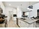 Open kitchen with island and sink, seamlessly integrated with the dining and living areas at 4367 Rhyme St, Kissimmee, FL 34746