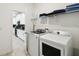 Convenient laundry room with modern washer and dryer, located near the kitchen at 4367 Rhyme St, Kissimmee, FL 34746