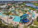 Aerial view of the community lazy river and splash pad with a slide in a residential community at 4367 Rhyme St, Kissimmee, FL 34746