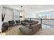 Living room with cozy seating, modern lighting, and a view from the railing at 4367 Rhyme St, Kissimmee, FL 34746