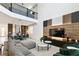 Open concept living space with black railings, connecting kitchen, dining, and living areas at 4367 Rhyme St, Kissimmee, FL 34746