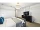 Bright main bedroom with gray dresser, stylish lighting, and white and gray color scheme at 4367 Rhyme St, Kissimmee, FL 34746
