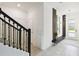 Beautiful staircase leading to the upper level, adjacent to the stylishly decorated entryway at 4367 Rhyme St, Kissimmee, FL 34746