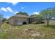 Backyard view showcasing the house exterior, patio, and well-maintained lawn at 5226 Smokey Water Ln, Oviedo, FL 32765