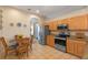 Eat-in kitchen with stainless steel appliances, tile floors, granite counters and breakfast nook at 5226 Smokey Water Ln, Oviedo, FL 32765