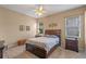 Spacious main bedroom featuring a ceiling fan and natural light at 5226 Smokey Water Ln, Oviedo, FL 32765