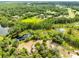 Breathtaking aerial view of lush landscapes featuring serene water features and dense tree coverage at 538 Murray St, Osteen, FL 32764