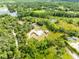 Stunning aerial view of a home nestled among lush greenery, with serene water features enhancing the landscape at 538 Murray St, Osteen, FL 32764
