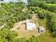 Breathtaking aerial view of property, featuring lake access, and outdoor entertainment area with wooden walkway at 538 Murray St, Osteen, FL 32764