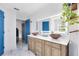 Modern bathroom with double vanity sinks, beautiful countertops, and a bright mirror at 538 Murray St, Osteen, FL 32764