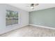 Well-lit bedroom featuring a large window and light-colored wood flooring, creating a spacious and inviting atmosphere at 538 Murray St, Osteen, FL 32764