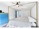 Comfortable primary bedroom with luxury bed frame, bright ceiling fan, and blue accent doors at 538 Murray St, Osteen, FL 32764