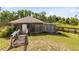 Rustic exterior with charming wooden accents and deck at 538 Murray St, Osteen, FL 32764