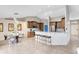 The eat-in kitchen features stainless appliances, lots of counter space, bar seating, and a view to the front door at 538 Murray St, Osteen, FL 32764