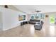 Comfortable living room featuring plush seating, neutral tones, and modern entertainment center at 538 Murray St, Osteen, FL 32764