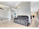 Open-concept living area features natural light and comfortable gray seating at 538 Murray St, Osteen, FL 32764