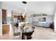 Open-concept living space with kitchen access, dining area, and a comfortable seating area for relaxing or entertaining at 538 Murray St, Osteen, FL 32764