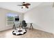 Bright home office with large window, desk, office chair, and tiled floors at 538 Murray St, Osteen, FL 32764