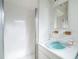 Bathroom showcasing clean shower and sink, with bright white tiles, providing a functional and inviting space at 5527 Sandalwood Dr, Orlando, FL 32839