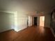 Bedroom with wood floors, ceiling fan, and multiple closets that offers space for an organized look at 5527 Sandalwood Dr, Orlando, FL 32839