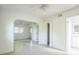 Spacious bedroom with archway, tile flooring, and natural light creating a serene and airy retreat at 5527 Sandalwood Dr, Orlando, FL 32839