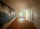 Open bedroom with decorative mural, wood floors, closet and window that provides natural light at 5527 Sandalwood Dr, Orlando, FL 32839