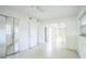 Bright bedroom with tile floor, mirrored closet, archway and neutral paint, creating a comfortable atmosphere at 5527 Sandalwood Dr, Orlando, FL 32839