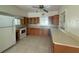 Functional kitchen with ample counter space, classic cabinetry, and an electric range oven at 5527 Sandalwood Dr, Orlando, FL 32839