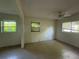Open living room featuring neutral walls, a ceiling fan, and multiple windows with blinds at 5527 Sandalwood Dr, Orlando, FL 32839