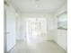 Bright living room with archway, tile flooring and large window, creating a spacious and inviting atmosphere at 5527 Sandalwood Dr, Orlando, FL 32839
