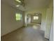 Open living area featuring neutral walls, ceiling fan, and views through archways to other rooms at 5527 Sandalwood Dr, Orlando, FL 32839