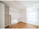 Large walk-in closet with wood flooring, shelving units, and overhead lighting at 5527 Sandalwood Dr, Orlando, FL 32839