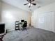 Bedroom featuring neutral walls, carpeted flooring, ample natural light, walk in closet and ceiling fan at 5852 Stafford Springs Trl, Orlando, FL 32829